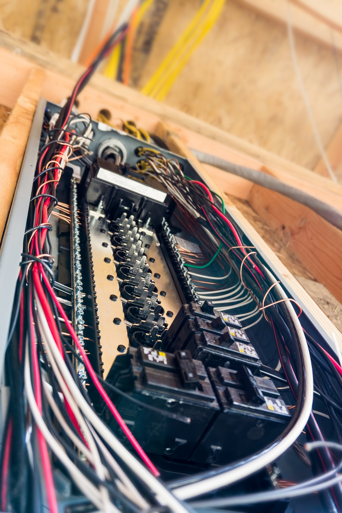 Licensed electrician installing a residential 200-amp panel
